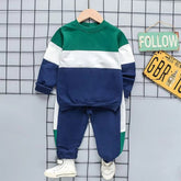Kids Colorblock Tracksuit Set in green, white, and navy with a cozy sweatshirt and joggers, perfect for play or lounging.